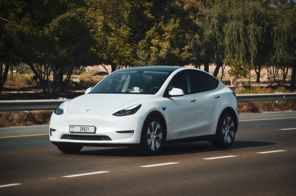 white electric car on abu dhabi highway